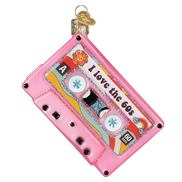 Pink cassette tape Christmas ornament with 'I love the 60s' text and retro floral designs.