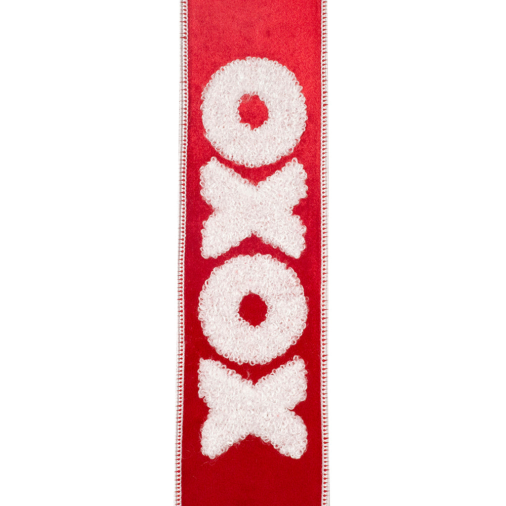 Red velvet ribbon with white plush embroidered XOXO pattern and stitched edges.