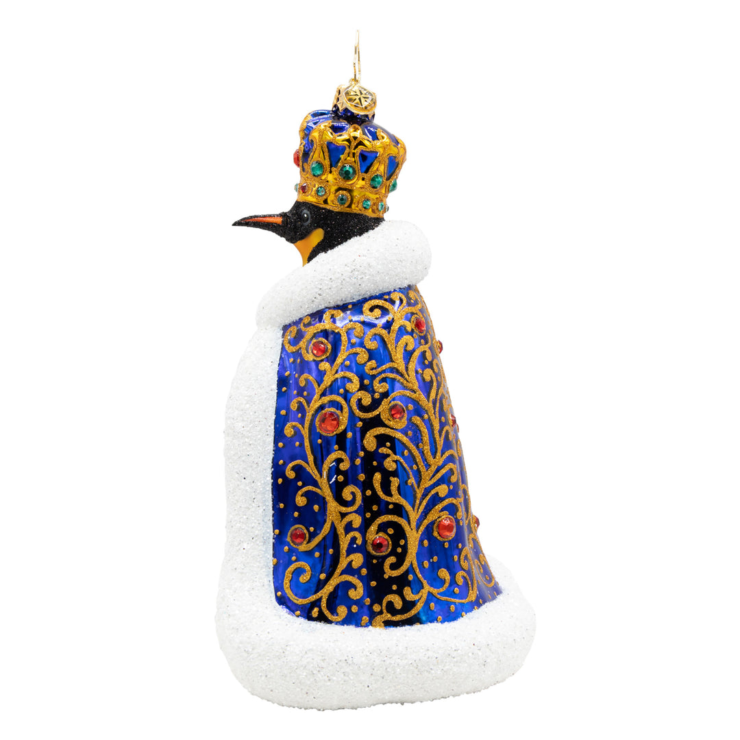 Emperor of the North penguin ornament in a sapphire cloak with a gold crown and gem accents.