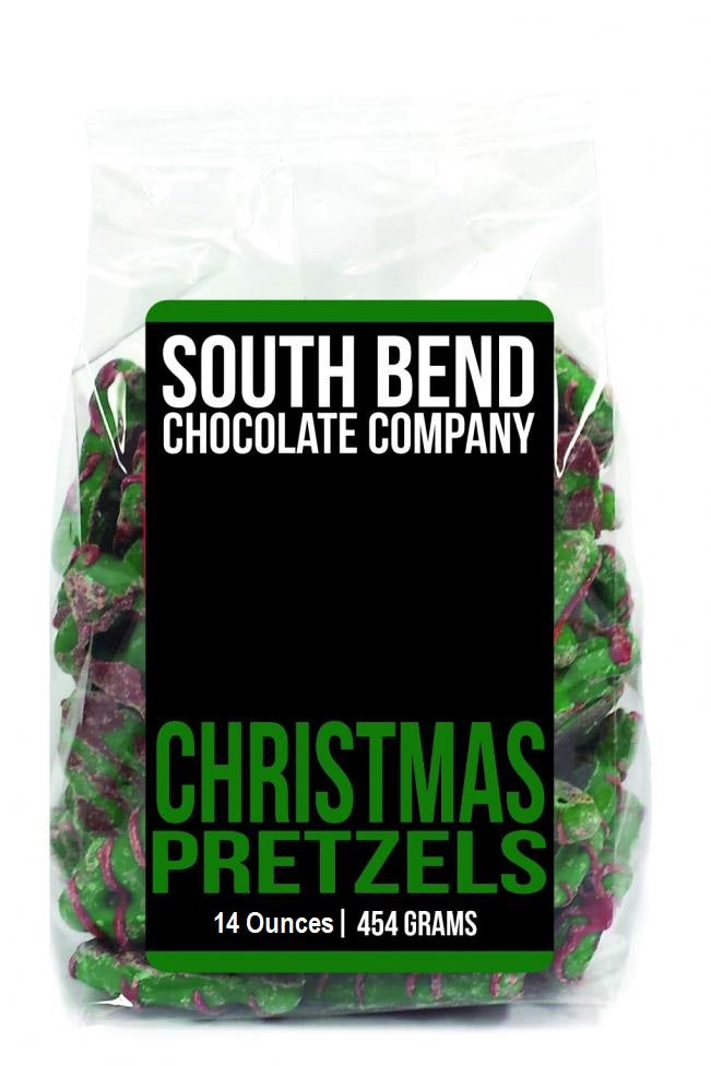 Bag of Christmas tree-shaped pretzels in a festive red and green holiday pattern.
