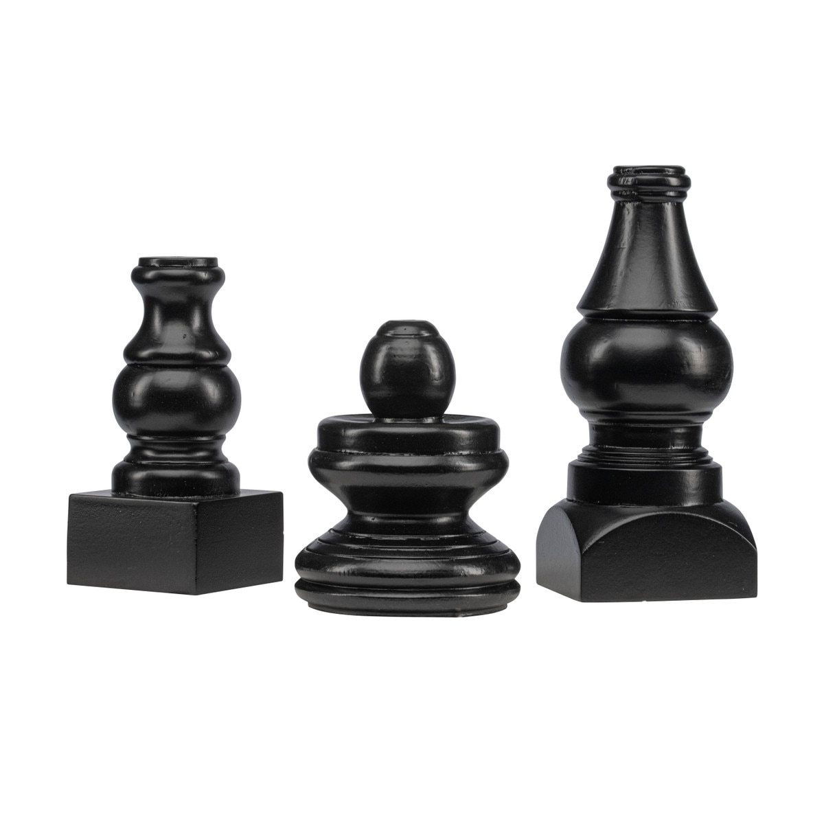 Three small black decorative display poles in varying heights and turned wood shapes.
