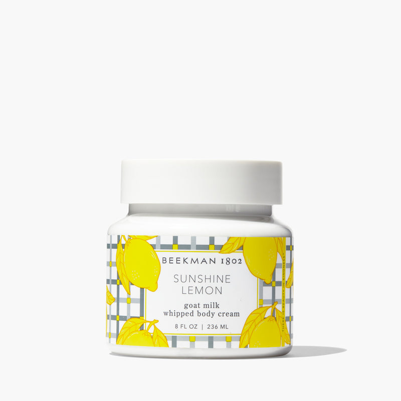 Beekman 1802 Sunshine Lemon Goat Milk Whipped Body Cream in an 8 fl oz white jar.