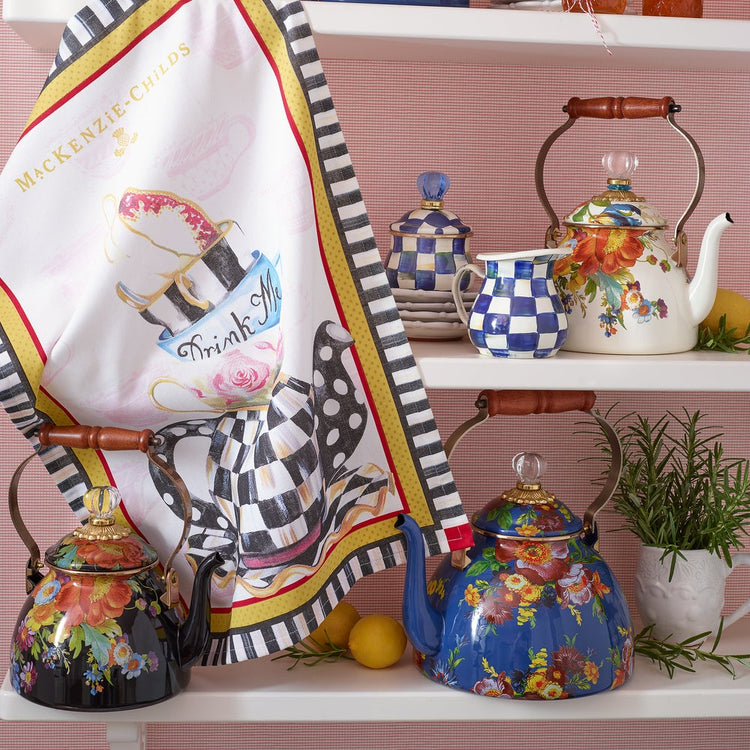 Royal Check Enamel Creamer with blue and white hand-painted checks on a kitchen shelf.