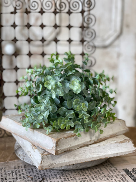 Greenbriar half-sphere planter made from green plastic with a smooth curved silhouette.