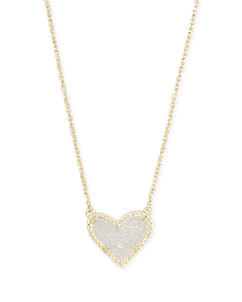Silver-tone asymmetrical heart pendant necklace on a chain with lobster clasp closure.