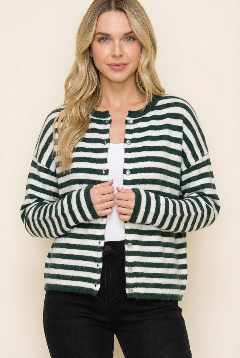 Woman wearing a green and white striped button-down sweater cardigan over a white top and black jeans
