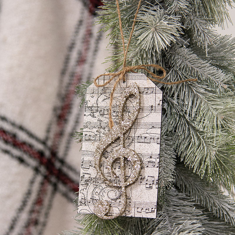 Glittered treble clef tag ornament in silver with gold glitter finish.