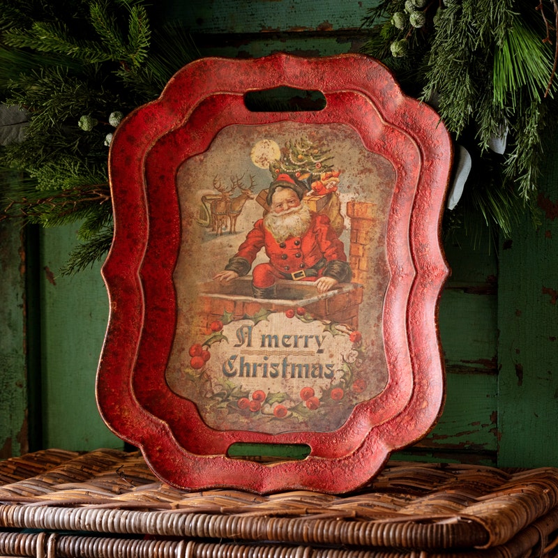 Vintage-style red metal tray featuring Santa Claus in a chimney with a Merry Christmas greeting.