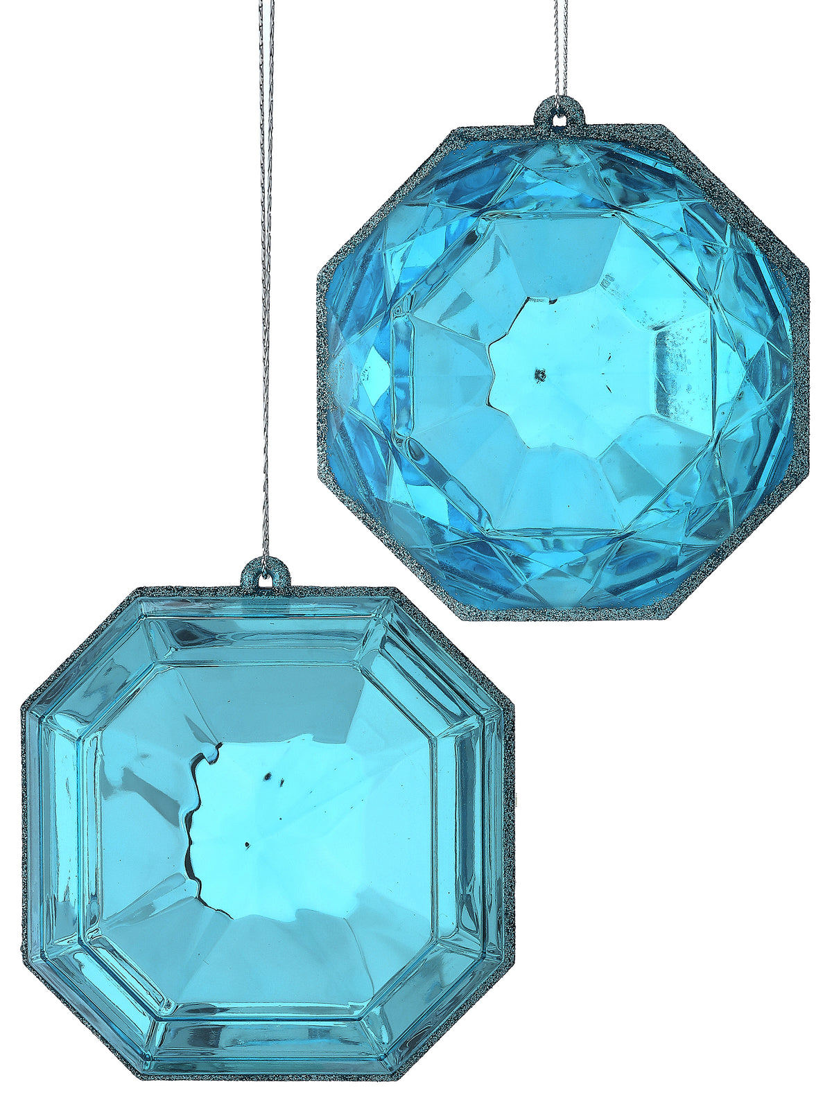 Two blue, faceted acrylic gem-shaped Christmas ornaments with glittery edges.
