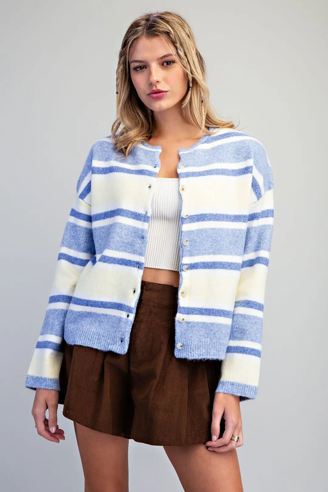 Nova Striped Button Front Cardigan in blue and white stripes with a collarless crew neckline.