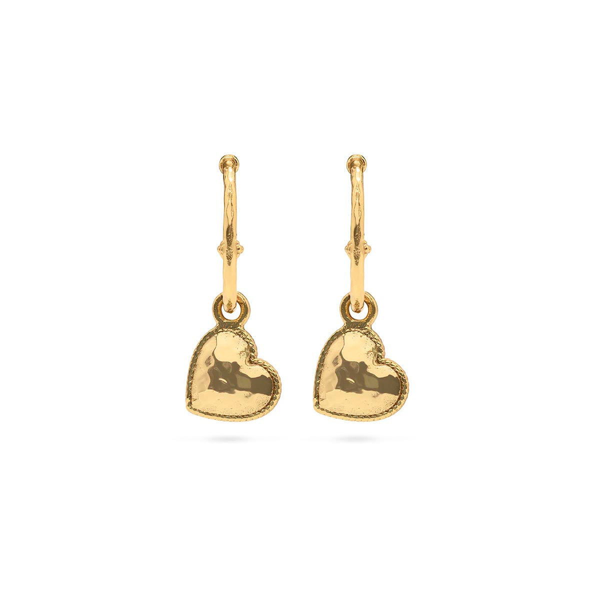 Gold hoop earrings featuring a heart charm pendant