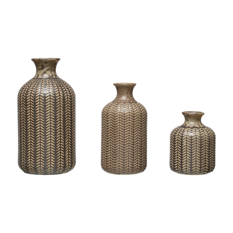Three embossed stoneware vases in varying sizes with a brown reactive glaze and chevron pattern.