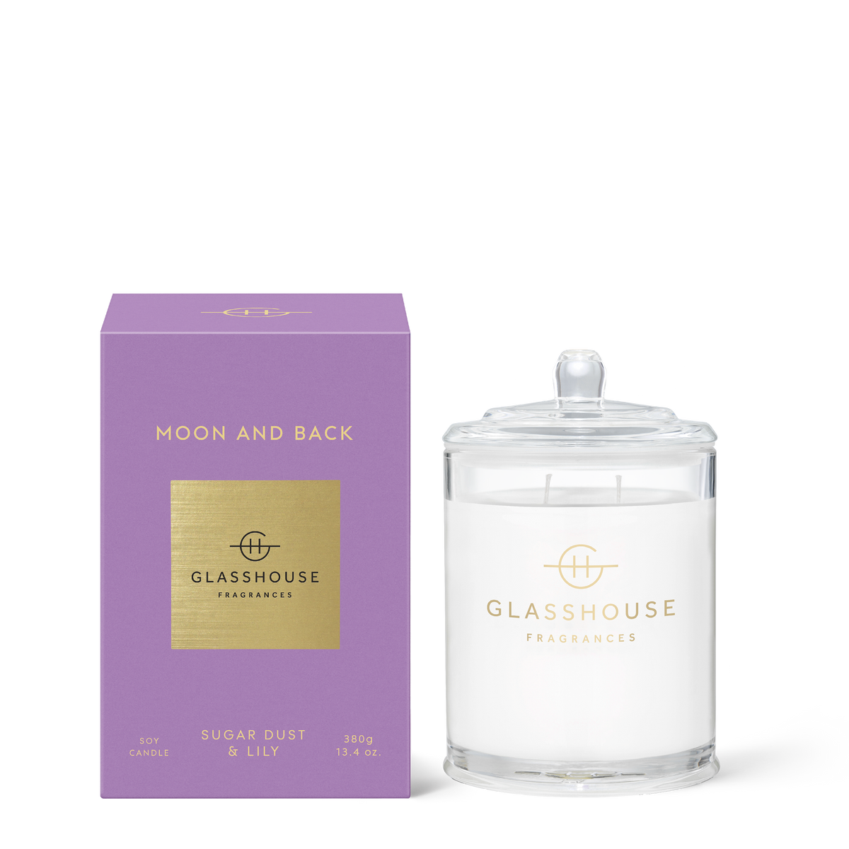 Glass jar candle with brown sugar wax, amber base notes, featuring a white wick and soft floral scent profile.