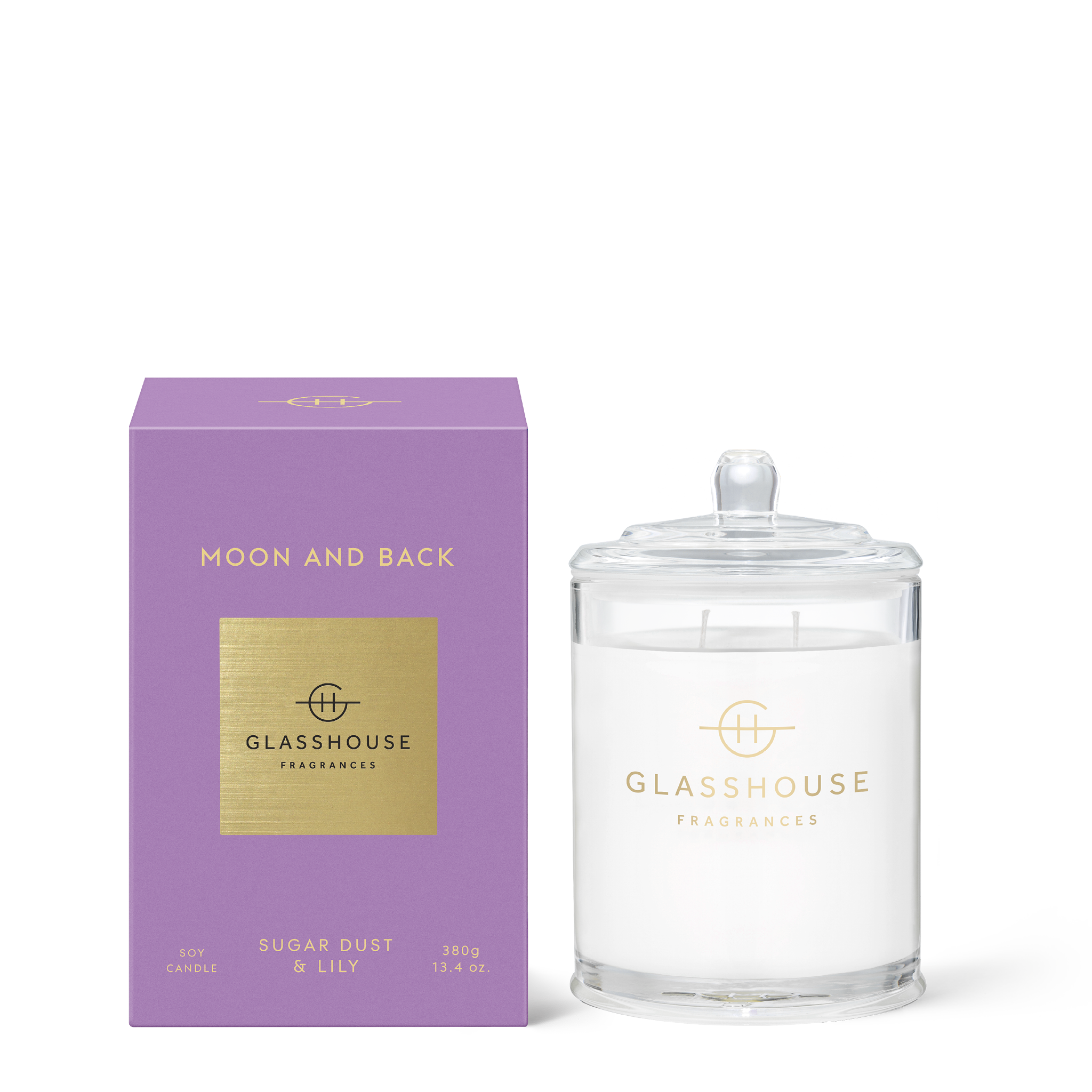 Glass jar candle with brown sugar wax, amber base notes, featuring a white wick and soft floral scent profile.