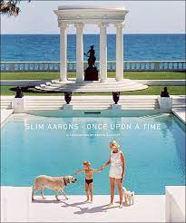 Hardcover book titled Slim Aarons: Once Upon a Time featuring black-and-white photography of wealthy lifestyles and Hollywood royalty.