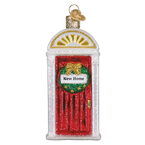 New Home ornament featuring a cozy room scene with warm lighting inside a clear glass bauble.
