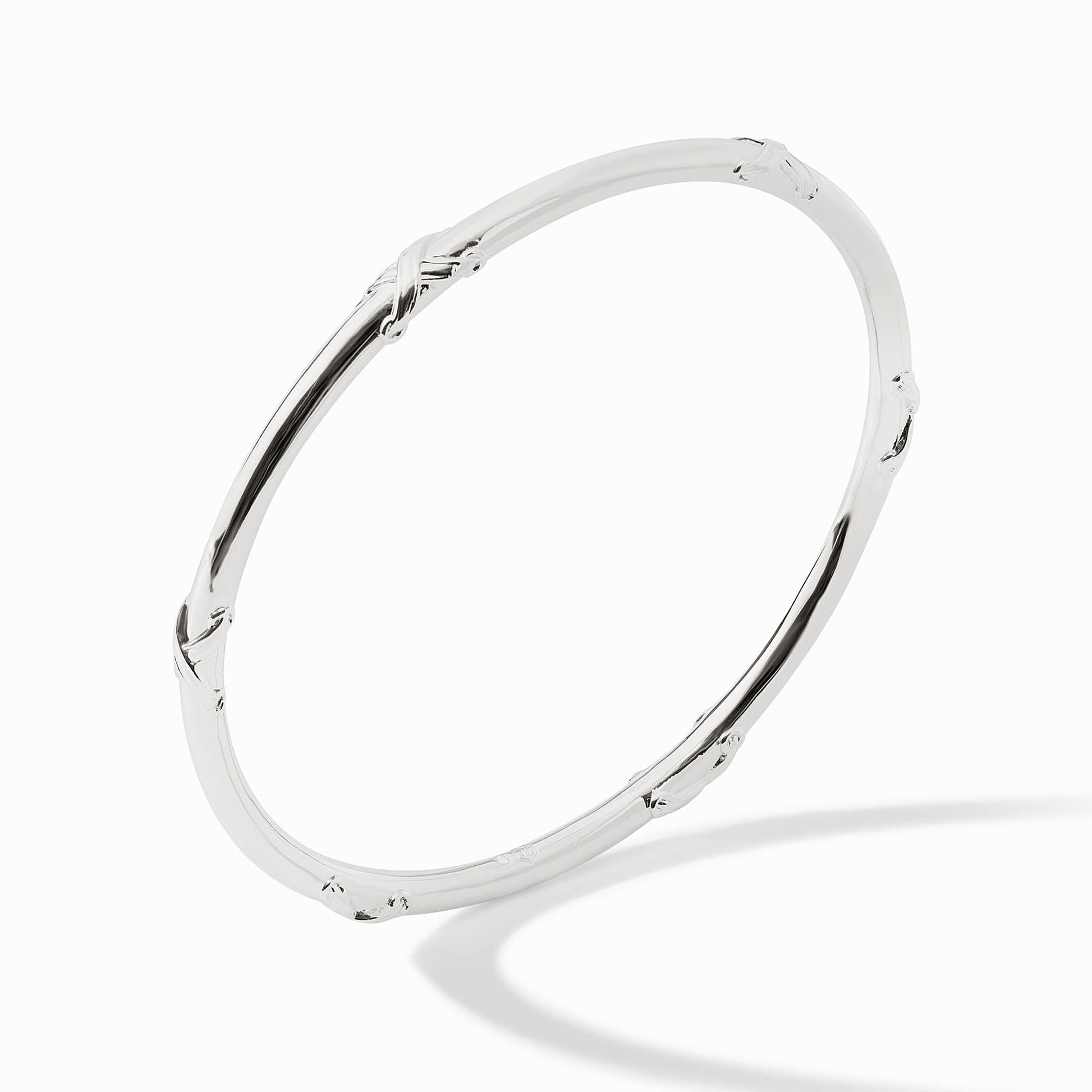 Silver Essex Bangle with a polished finish and subtle textured knot details.