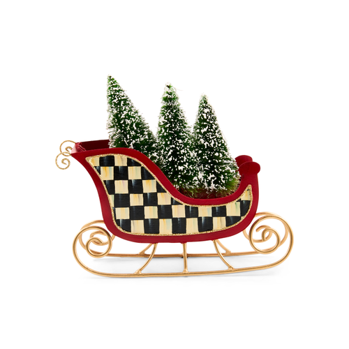 Merry Christmas red tin sleigh with black and white checkered pattern carrying three snowy trees.