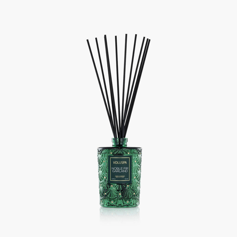 Black reed diffuser bottle with Noble Fir garland scent in a clear glass container.