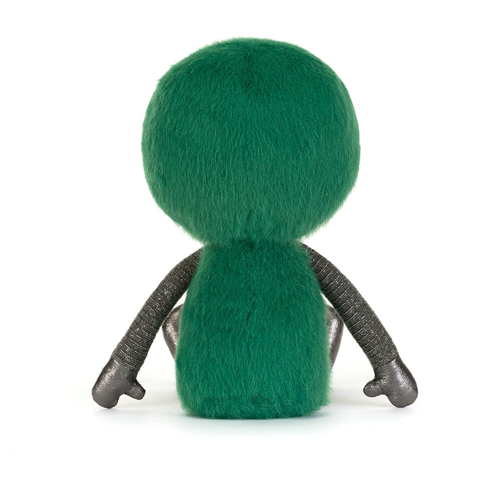 Back view of Zyllan Alien, a green fuzzy plush toy with long metallic silver arms and legs.