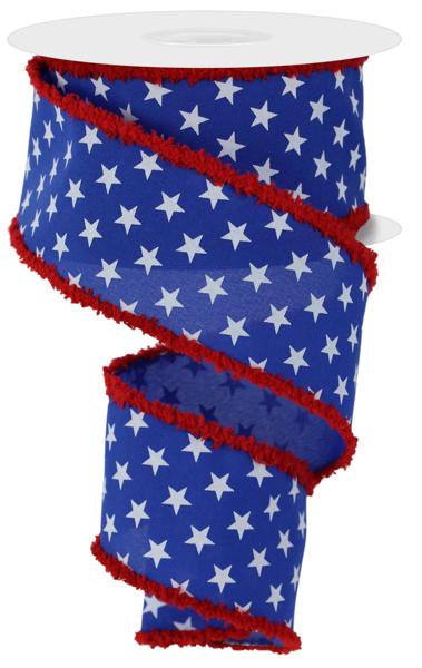 Royal blue ribbon with white stars and a frayed red edge on a spool.