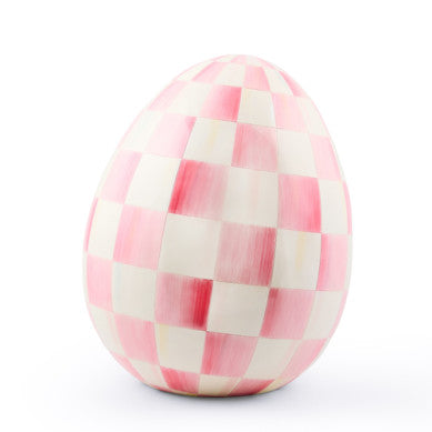 Large resin decorative egg sculpture with a natural stone-like texture in beige tones.
