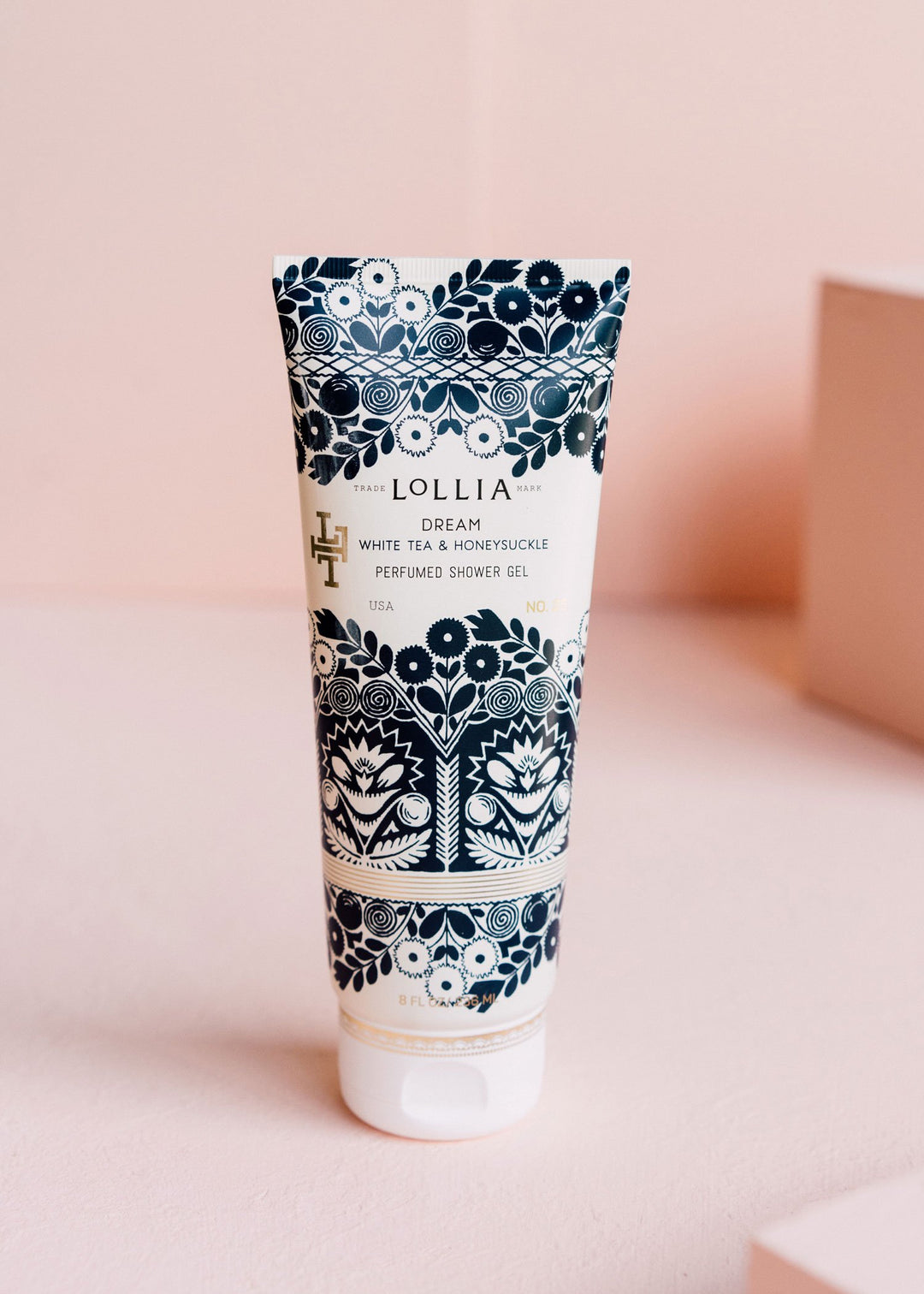 Royal blue satin-touch tube with metallic detailing featuring elegant floral patterns