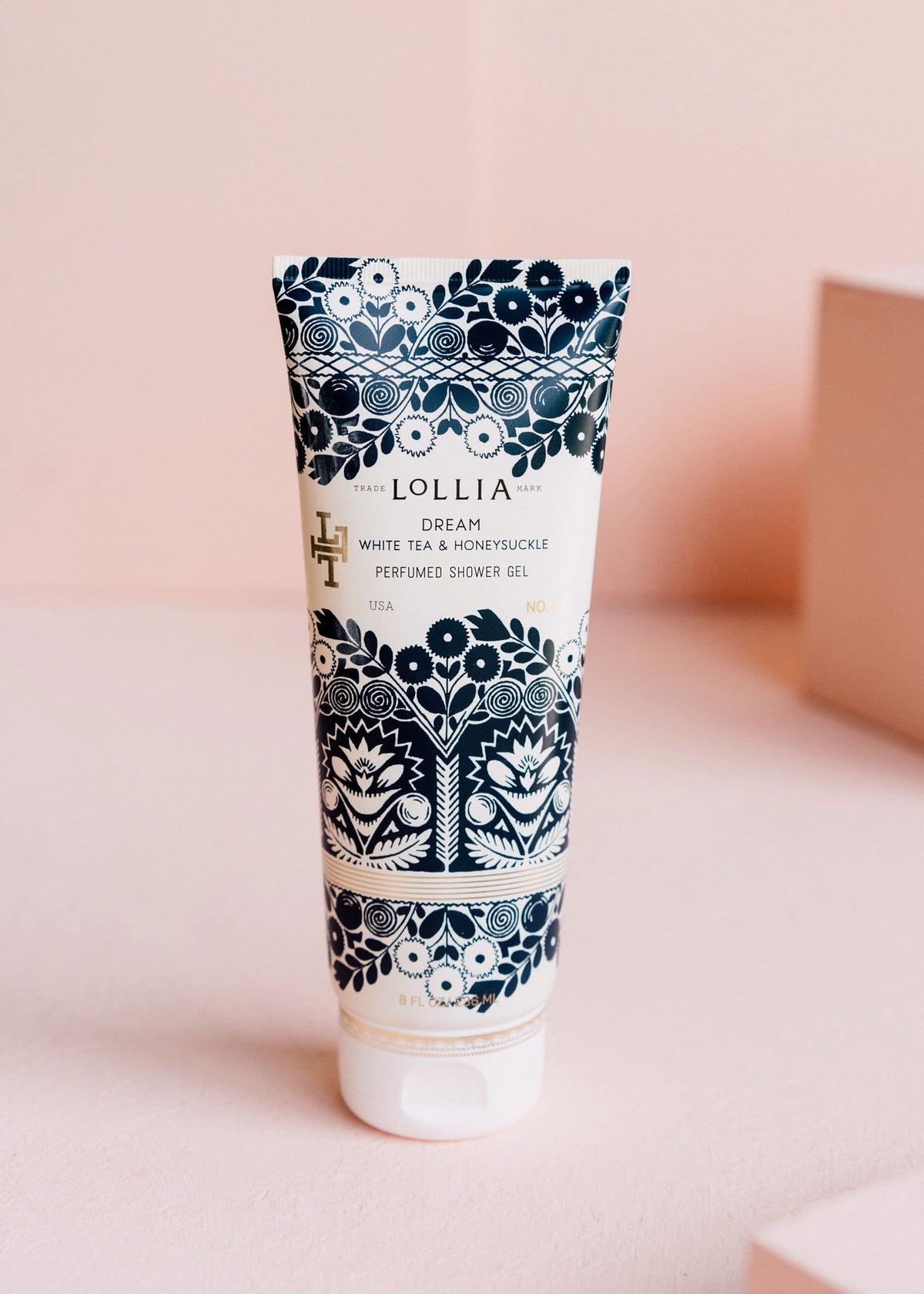 Royal blue satin-touch tube with metallic detailing featuring elegant floral patterns