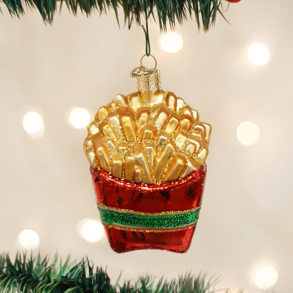 Glass French fries Christmas ornament in a red container with a green glitter stripe.