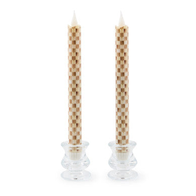 Two mocha-colored flameless dinner candles with a checkered wax exterior pattern.