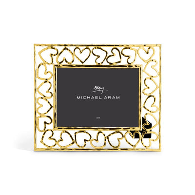 Gold-tone convertible photo frame holding a 5x7 inch photograph.