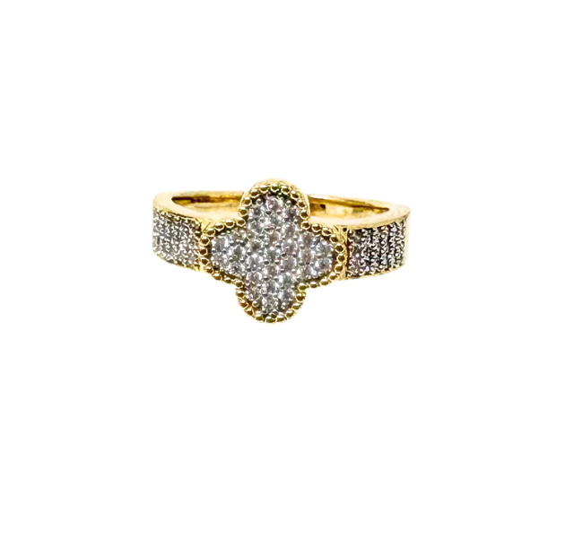 Gold fashion statement ring with a diamond-encrusted four-leaf clover center and pavé band.