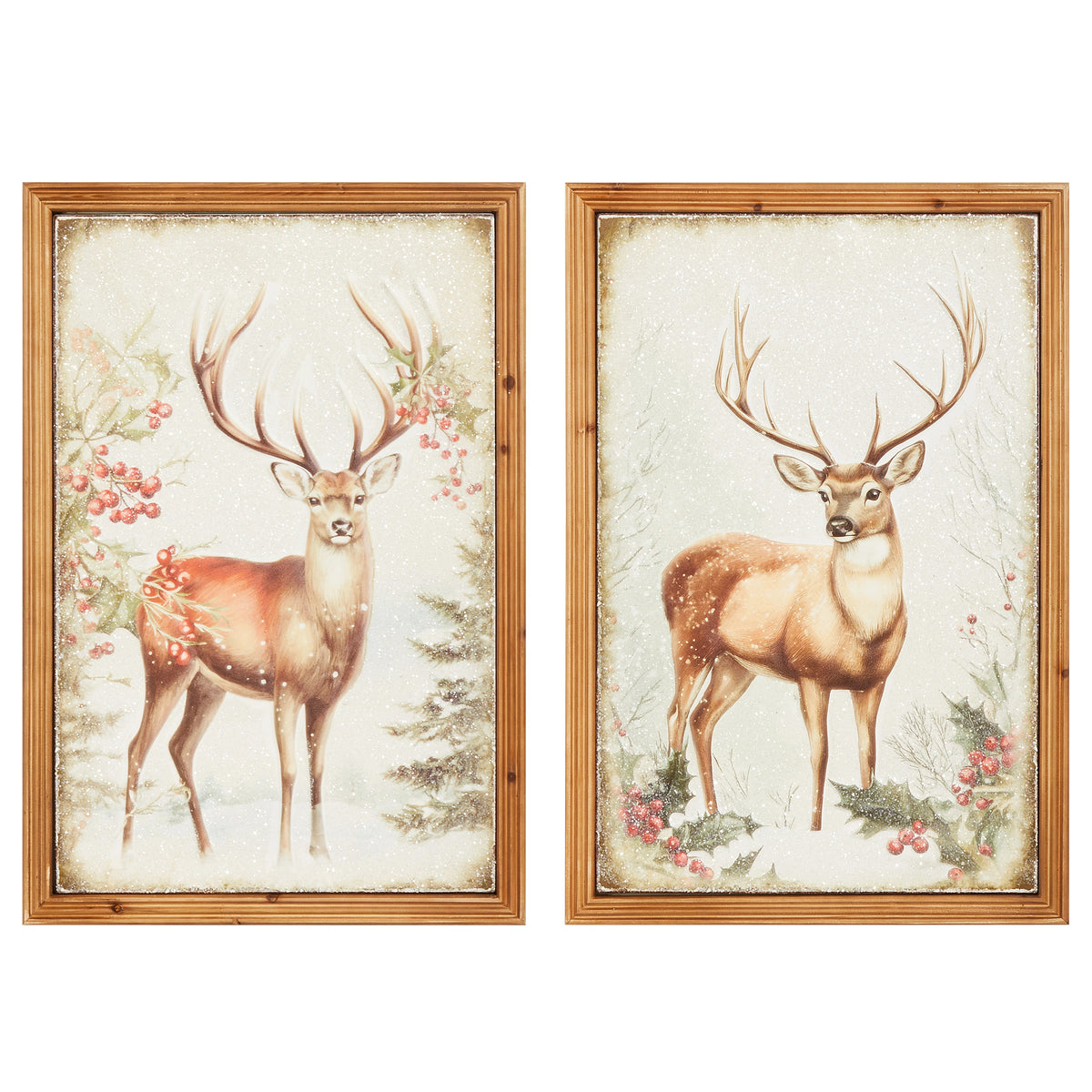 Two framed metal wall art pieces featuring stags in a snowy winter scene with holly and berries.