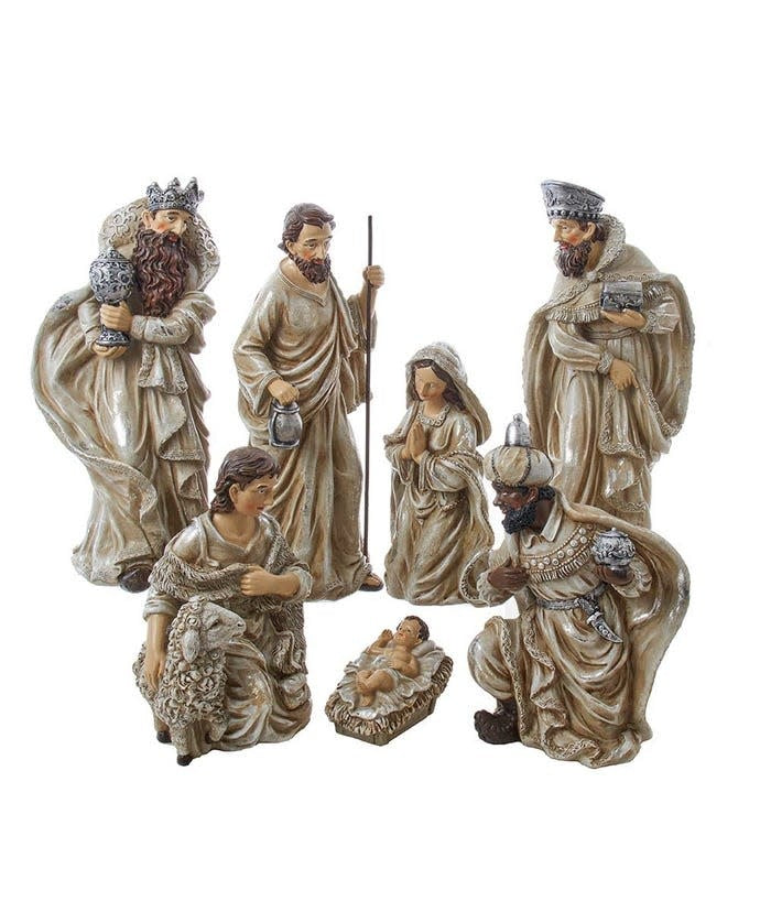 Seven-piece nativity figurine set in white polyester featuring the Holy Family, Three Wise Men, and a shepherd.