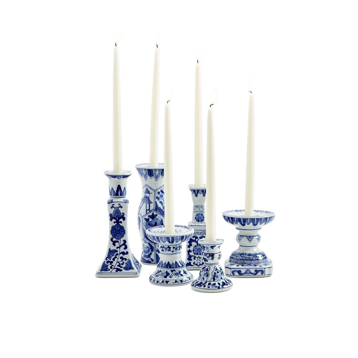 Assorted hand-painted blue and white ceramic Canton candleholders with white taper candles.