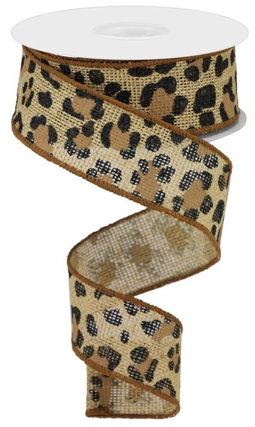 A spool of leopard print ribbon made from polyester fabric.