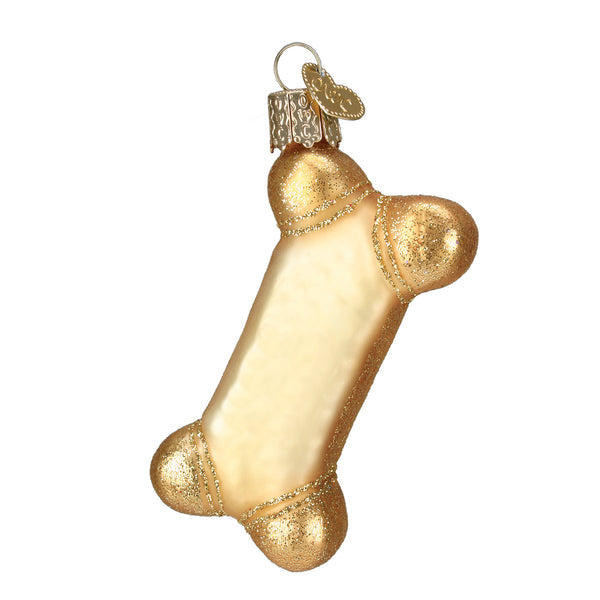 Gold glittery glass dog biscuit Christmas ornament with a hanging loop and heart charm.