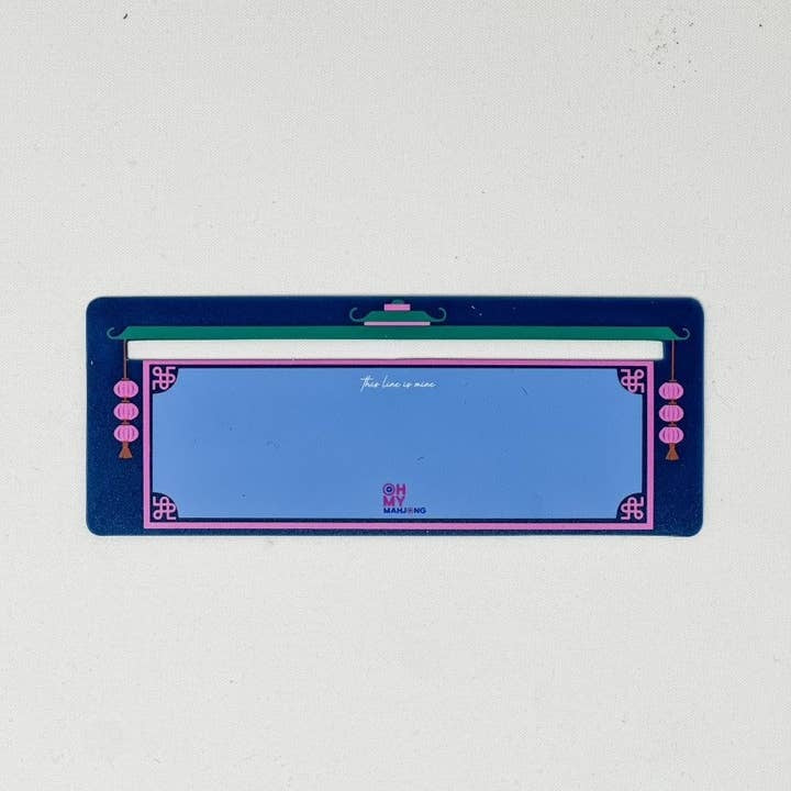 Navy blue plastic Mahjong line finder with a clear window to reveal the tile's suit and number.
