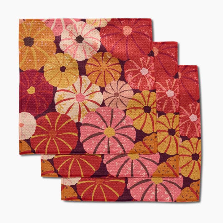 Set of three waffle weave dishcloths in recycled polyester with single-sided prints and hang loops.