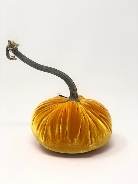 Handmade velvet pumpkin in deep orange with a natural stem.