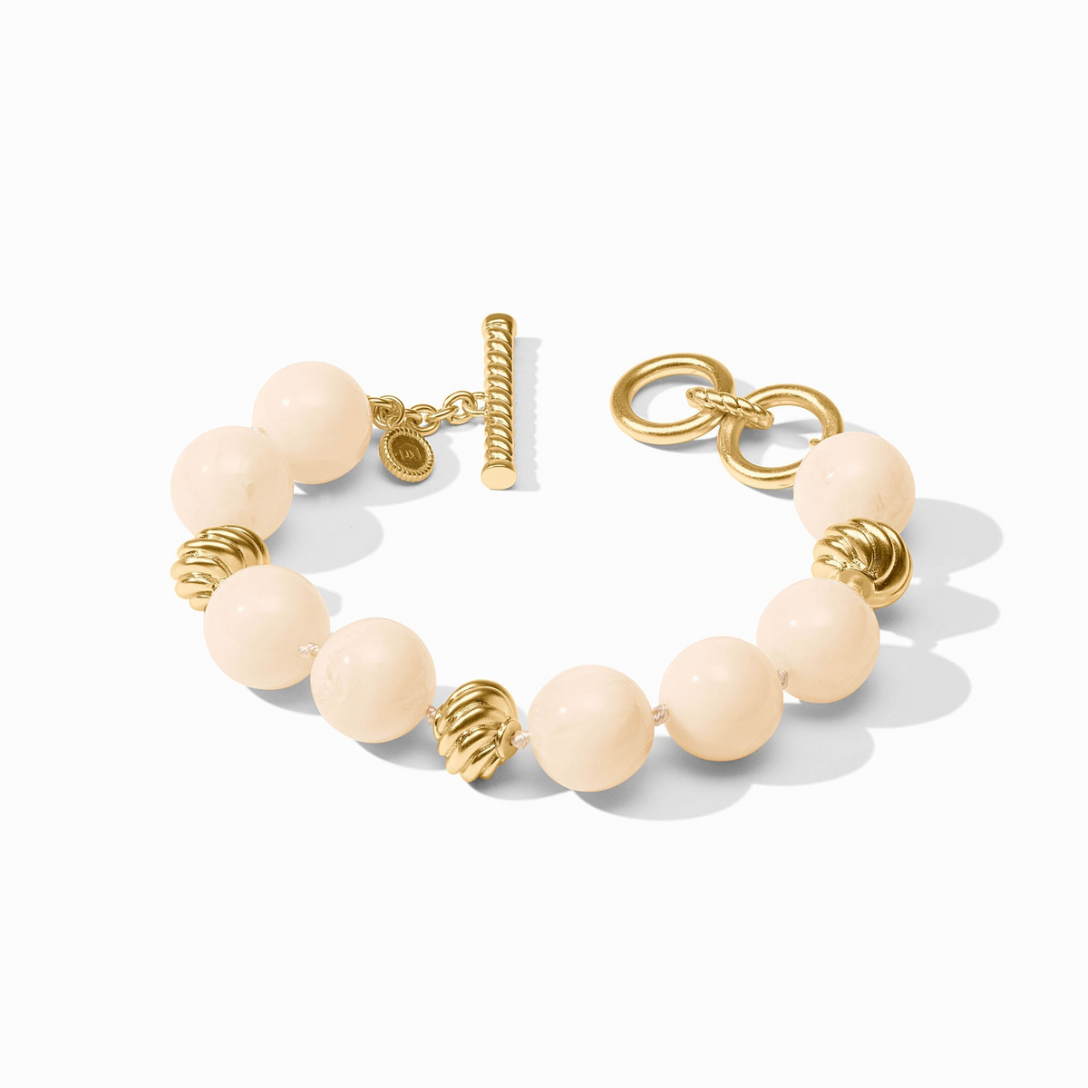 Ravello Bracelet featuring cream resin beads and 24K gold-plated accents with a toggle closure.