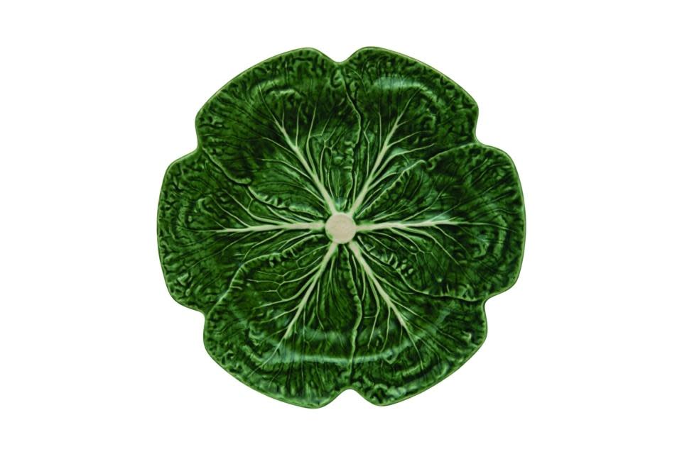 Green cabbage-shaped charger plate with a leafy vegetable silhouette.