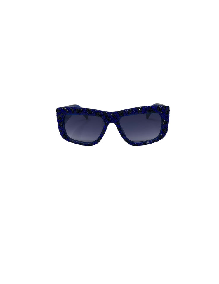 Rectangular sunglasses with blue and black rhinestone-encrusted frames and dark tinted lenses.