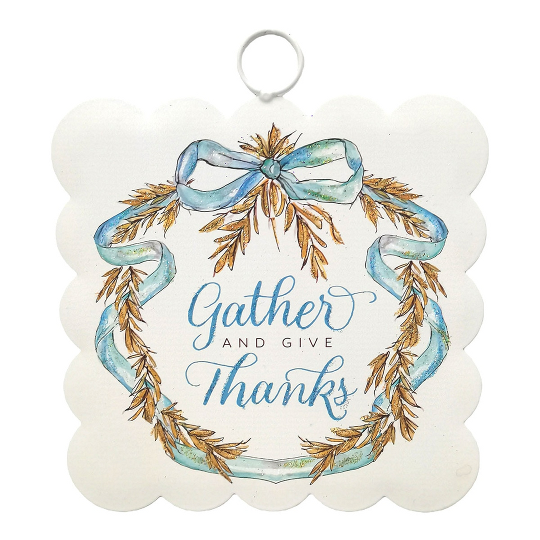 Mini scalloped metal hanging art featuring a wheat wreath and the phrase Gather and Give Thanks.