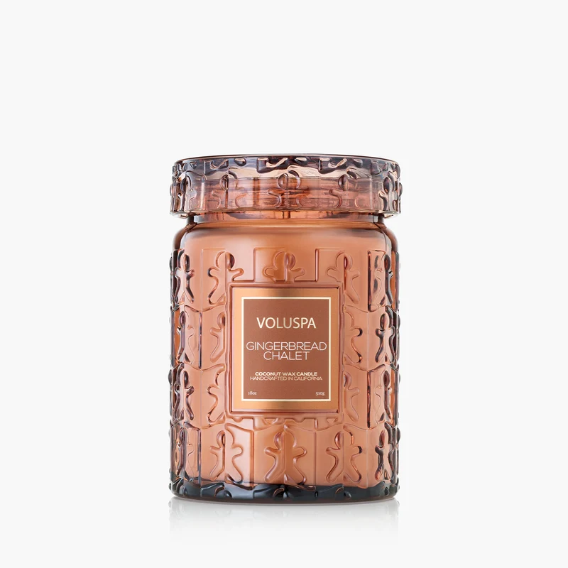 Voluspa Gingerbread Chalet 18oz Large Jar candle in a brown glass jar with gingerbread man patterns.
