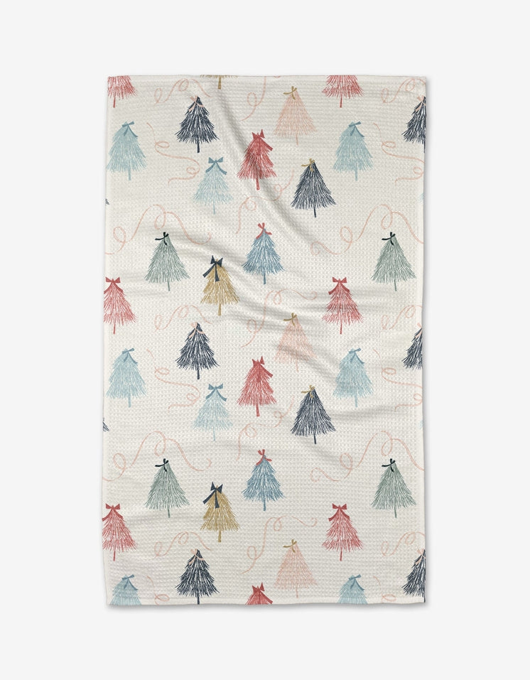 Holiday tea towel with waffle weave construction in red featuring a festive snowflake pattern.