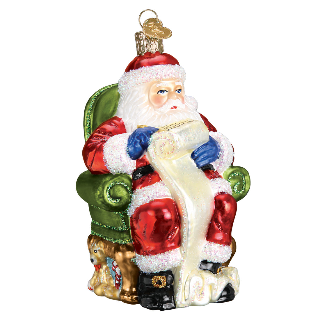 Glass Santa ornament sitting in a green chair checking a long list with a puppy at his feet.