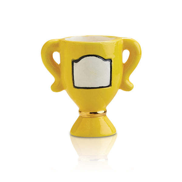 Yellow ceramic trophy-shaped egg cup with a white plaque and gold band detail.