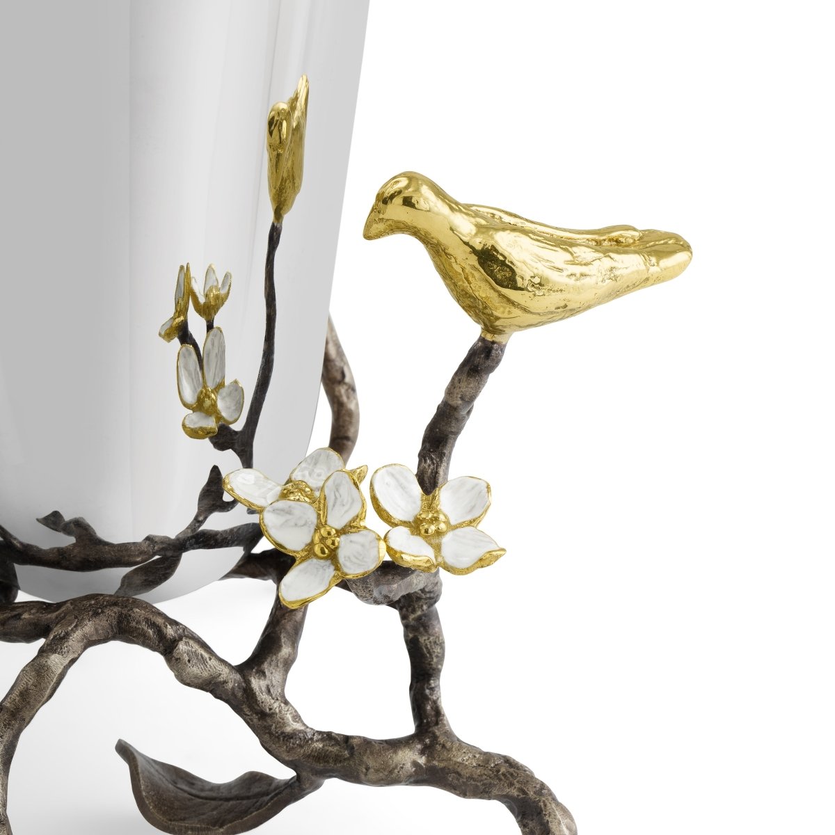 Small stainless steel vase with oxidized brass accents featuring white four-petaled enamel flowers symbolizing unity.