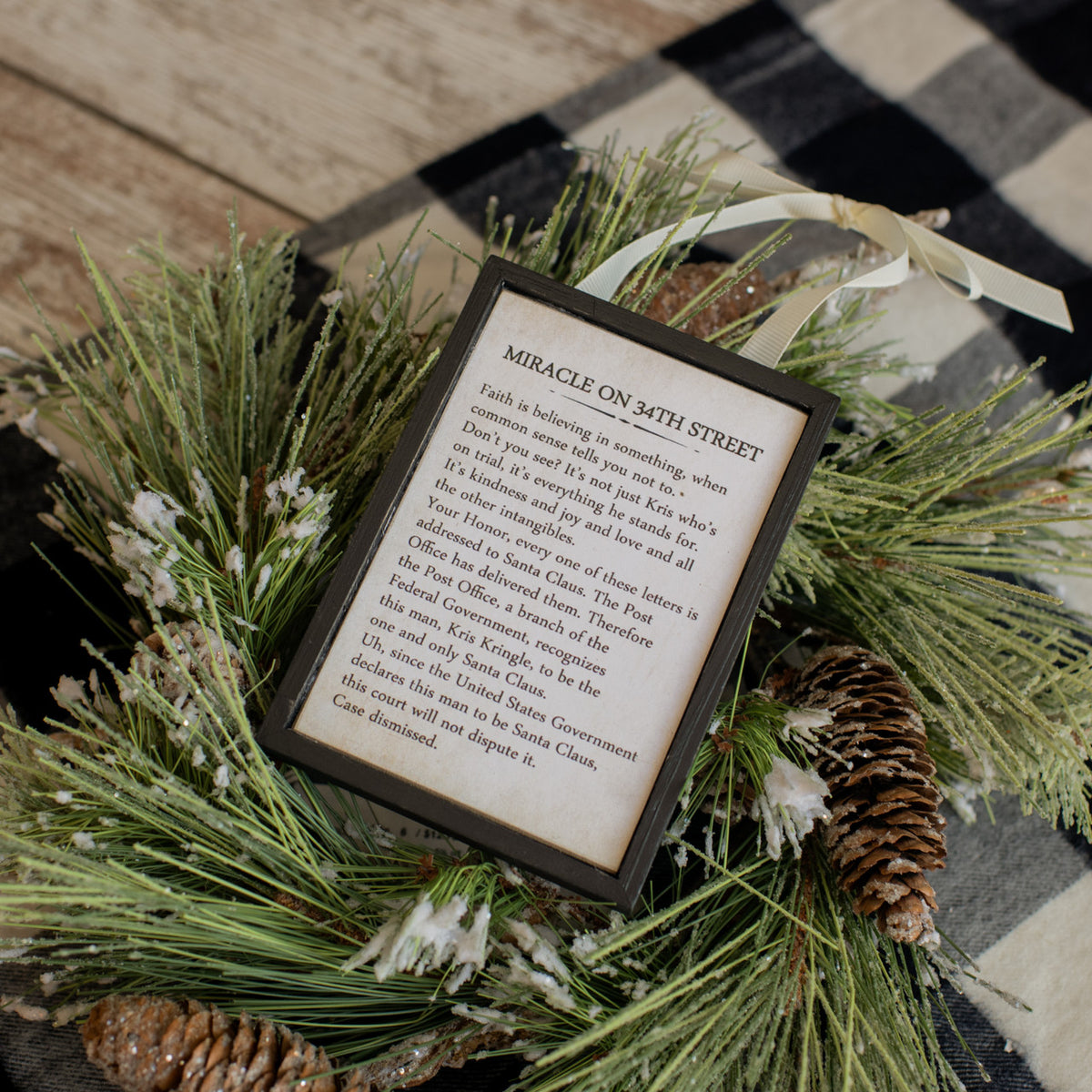 Wooden sign ornament shaped like a lowercase 'e' in natural wood tone.